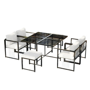 Fauteuils Séville disposés autour de la table en verre